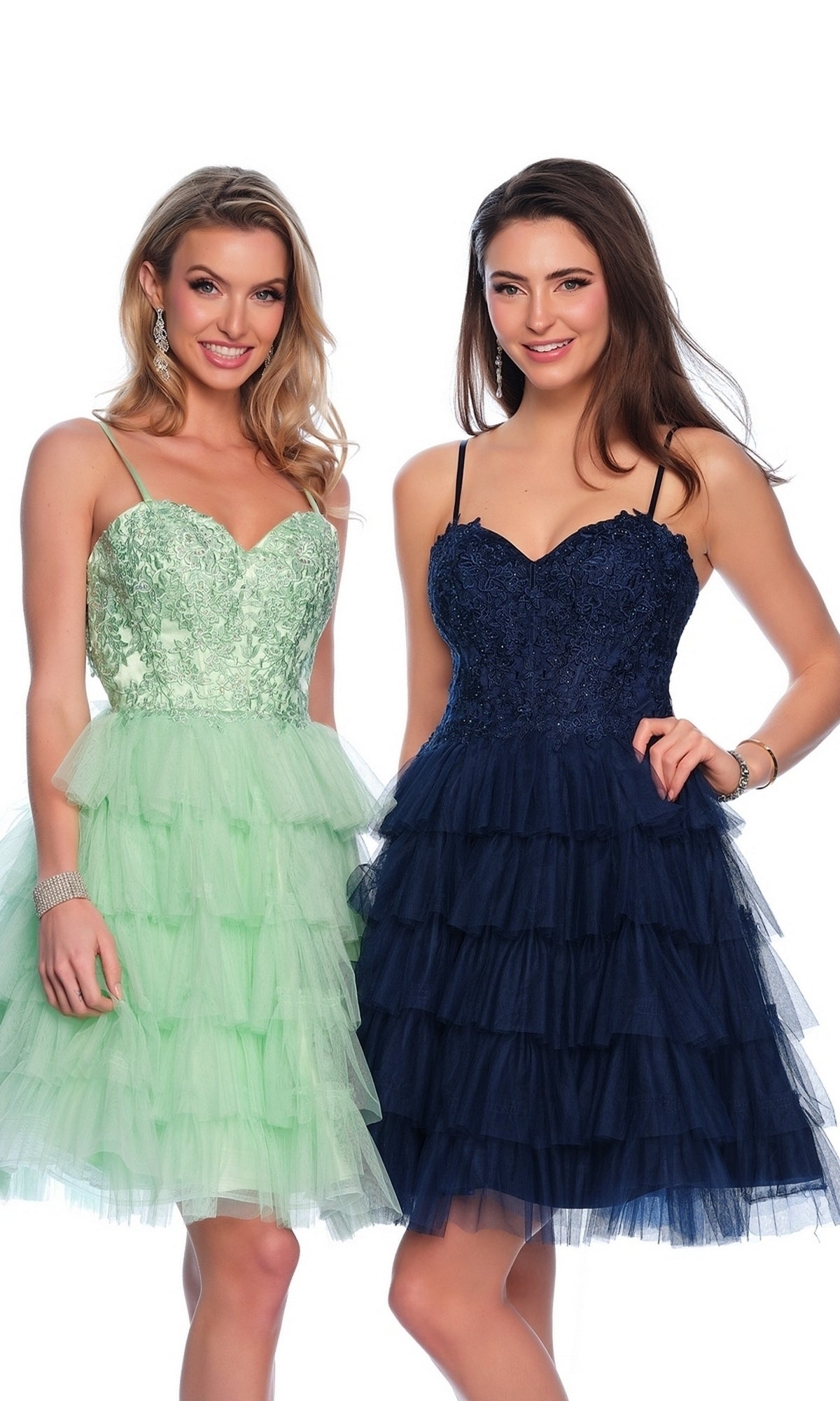 Two women wear Dave and Johnny Short Ruffled Hoco Dress 11182—one in light green with lace, the other in navy blue—both featuring embroidered sweetheart bodices, thin straps, and layered A-line skirts.